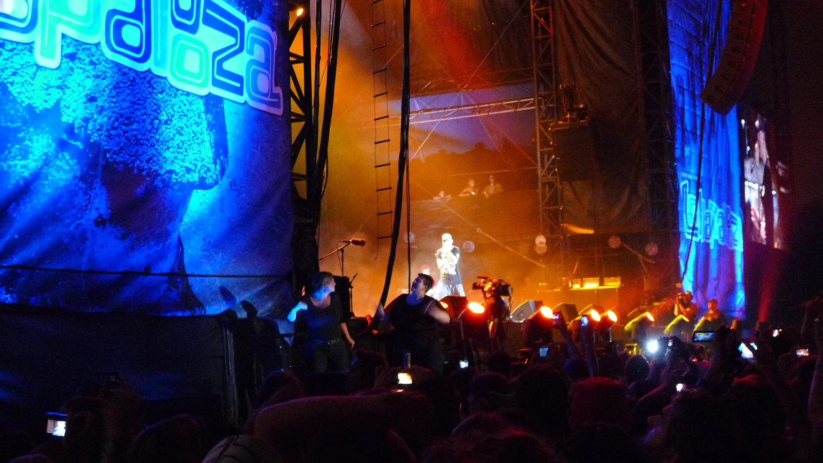 Eminem performing with his band at the 2011 Lollapalooza festival.
