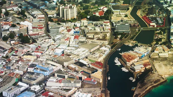 Aerial view of Bridgetown, Barbados in the West Indies (facing east), with clear view of the Wharf, the main bus terminal, the Central Bank and other buildings and the associated streets