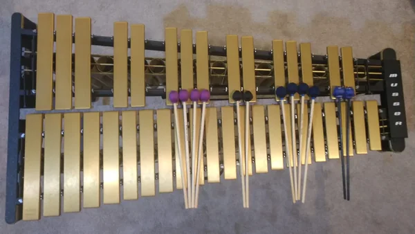 An overhead shot of a Musser M-55 vibraphone with a variety of mallets by different makers.