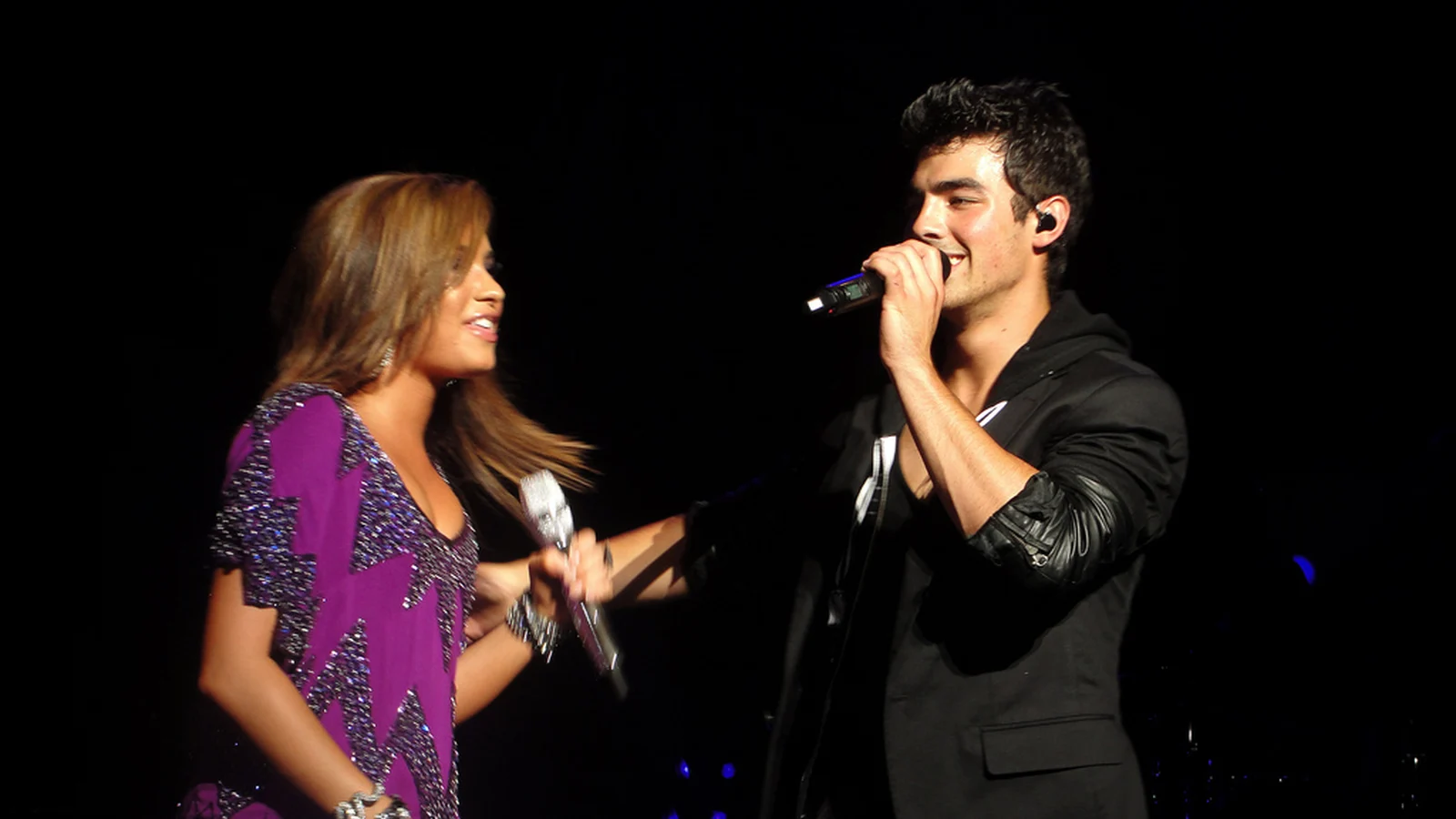 Joe Jonas and Demi Lovato performing in the Jonas Brothers Live In Concert