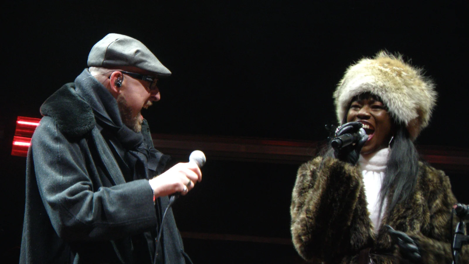 Mario Biondi is singing with a singer of the British Band Incognito in piazza Duomo, Milan, Italy.