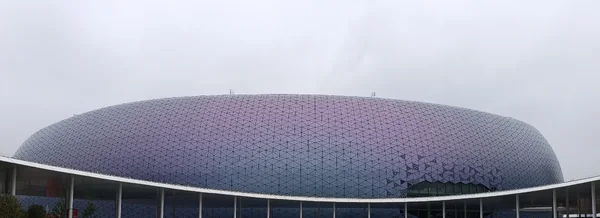 Kai Tak Stadium’s facade in Hong Kong. Cropped archival venue photograph made in April 2025; not a photograph of NuNew’s TIMA performance.