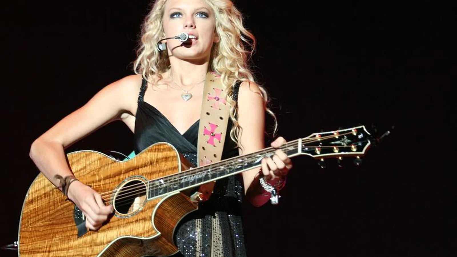 American country musician Taylor Swift performing live.