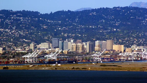 Oakland skyline and port as seen from Twin Peaks in San Francisco, CA.