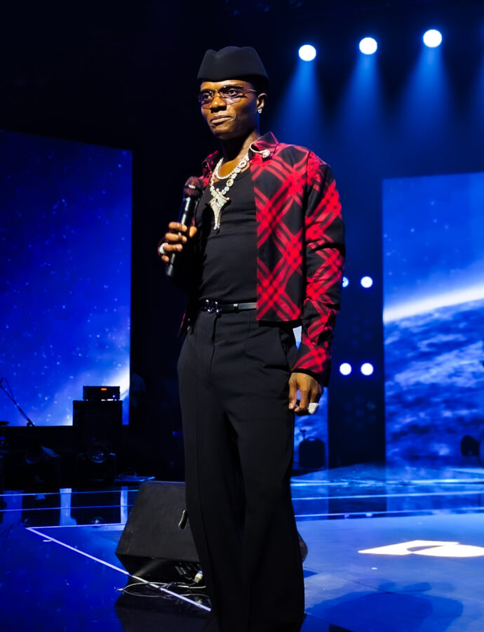 Person standing on stage with microphone